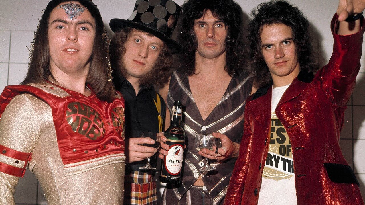 Рок 70 80 годов зарубежные. Слейд рок группа. Slade Stone. Английская группа 80 х годов. Фронтмен группы 70-х.