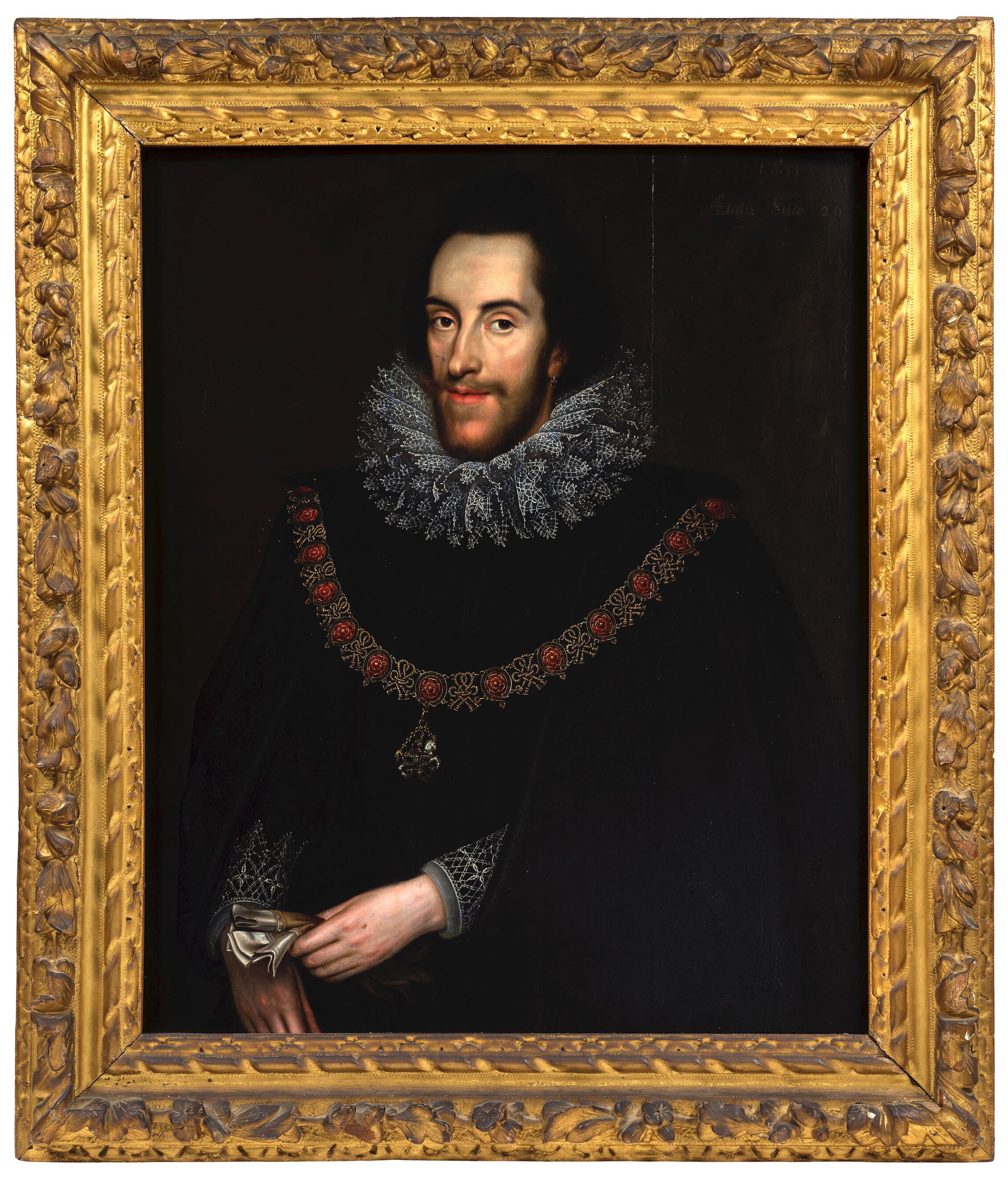 Portrait of Thomas Howard, 14th Earl of Arundel, half length, in a black costume and white lace ruff, with the collar of the Garter and holding gloves in his left hand in a carved frame.jpg